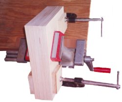 after aligning the stack of vertical panels, you can clamp them together and place them in a vise for sanding