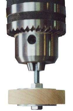 clamp the nut, bolt and yo-yo assembly into the chuck of a drill press