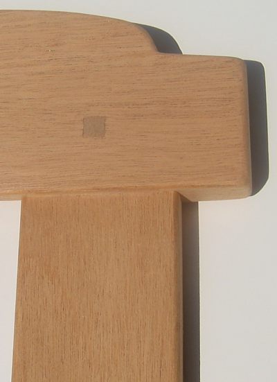 square peg penetrating through tenon